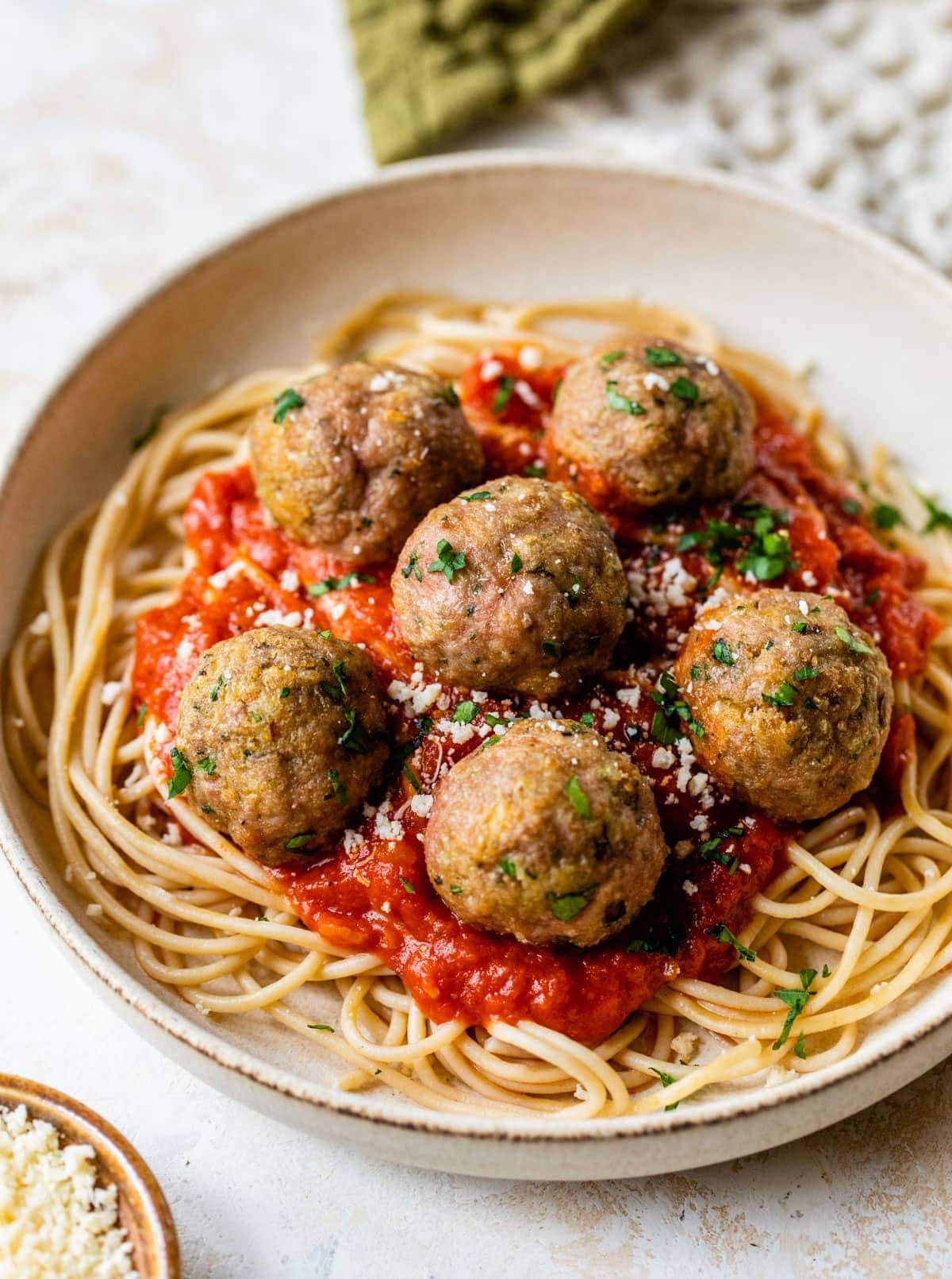 Spaghetti pasta topped with marinara sauce and turkey meatball.