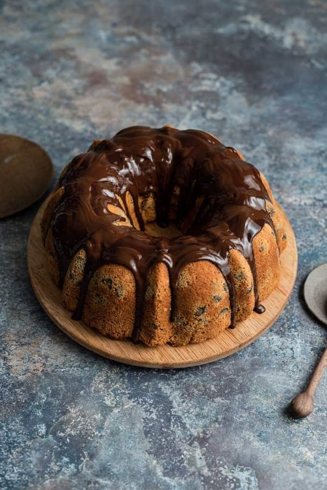 Chocolate Bundt cake topped with chocolate syrup.