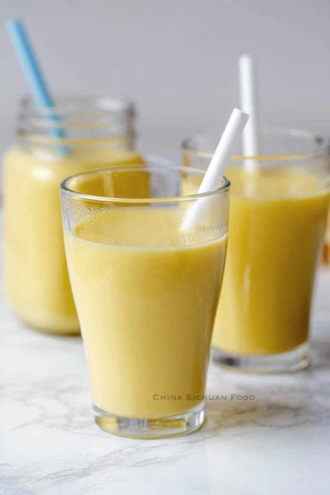 Corn milk served on glasses with straw.