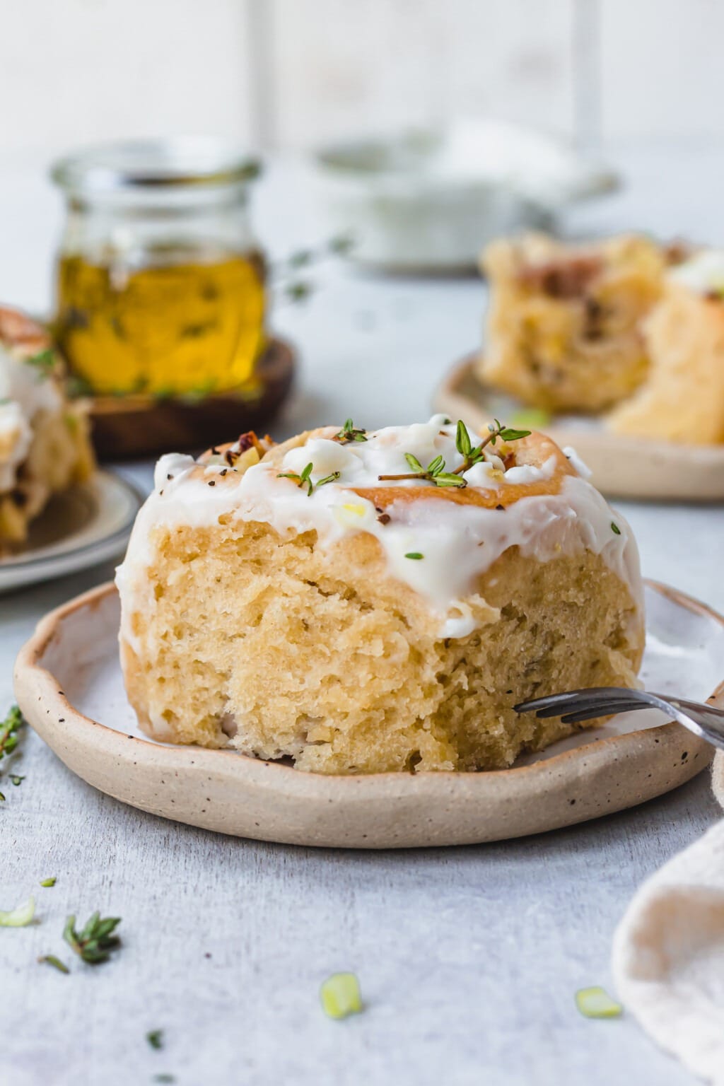 Bread roll with sugar glaze on top.