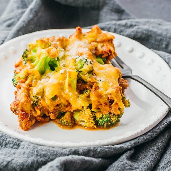 Serving of ground beef and broccoli casserole with fork.