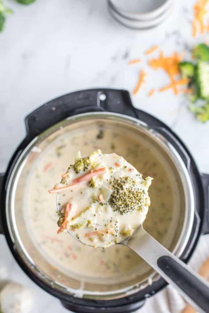 Ladle spooned broccoli cheese soup from Instant pot.