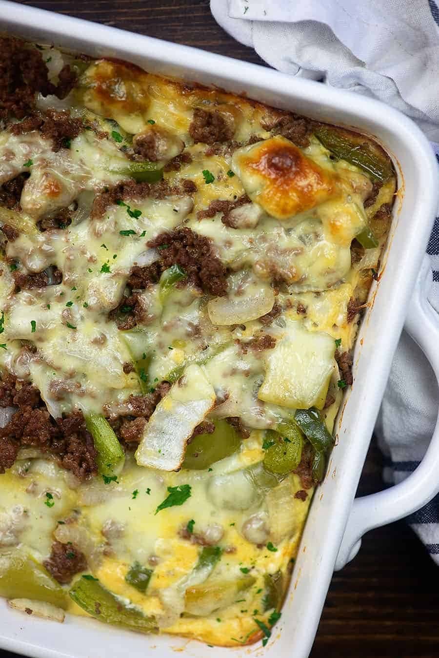 Top view of Philly Cheesesteak Casserole made with melted mix of beef, bell peppers, garlic, onions, and lots of cheese.