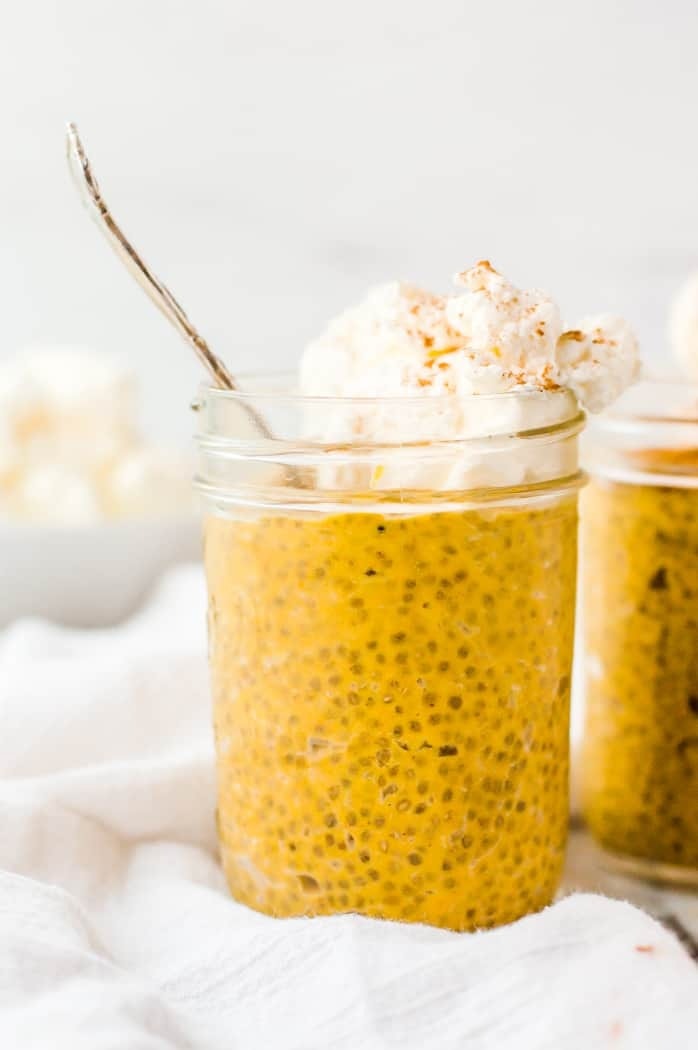 Pumpkin chia pudding served in mason jar topped with vanilla.