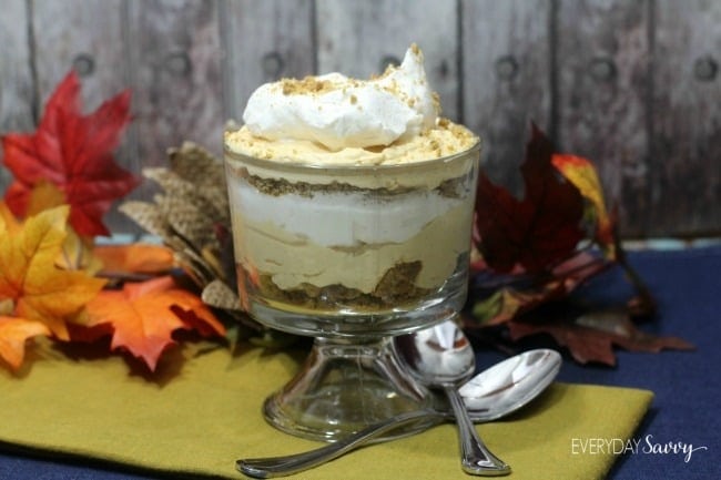 Layered Pumpkin parfait pudding with whipped cream on top.