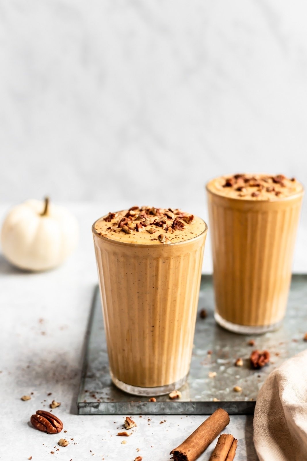 Two glasses of pumpkin pie smoothies.