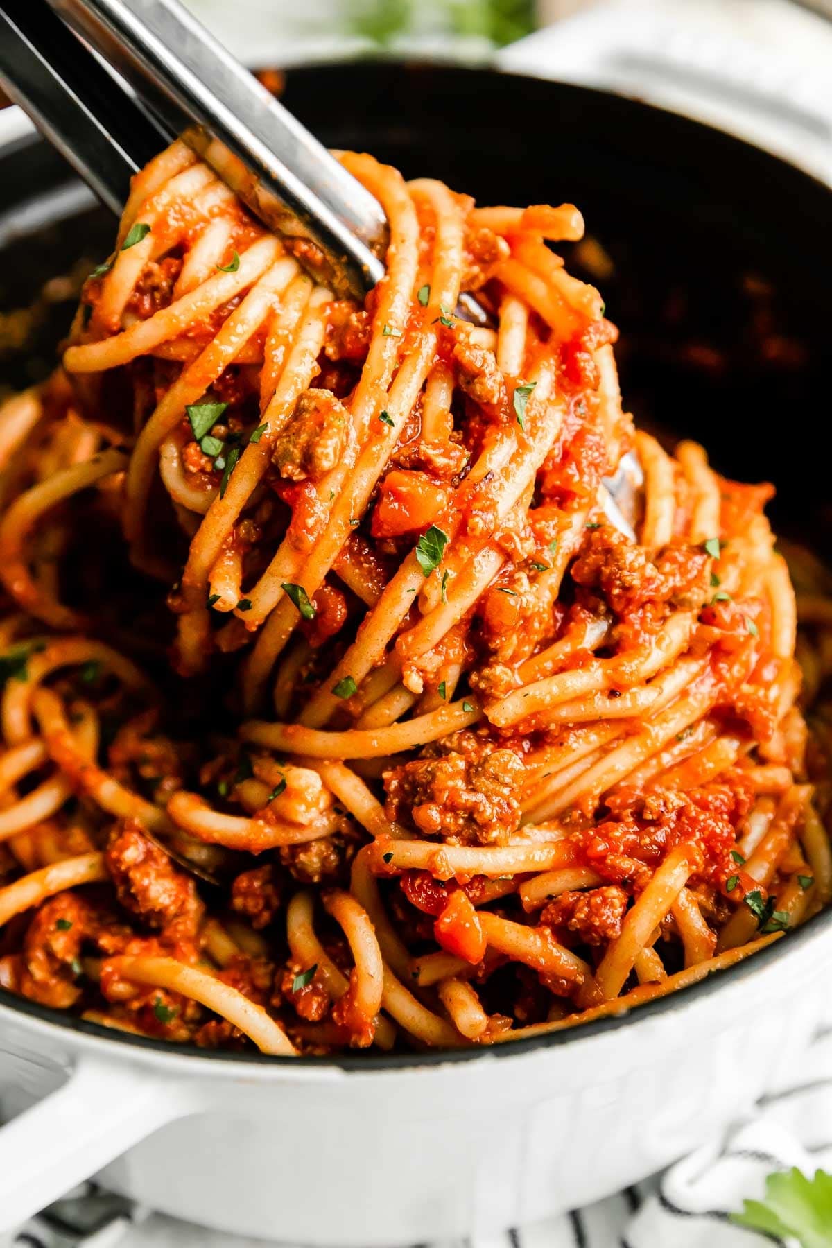 Spaghetti with turkey Bolognese sauce on a pot.