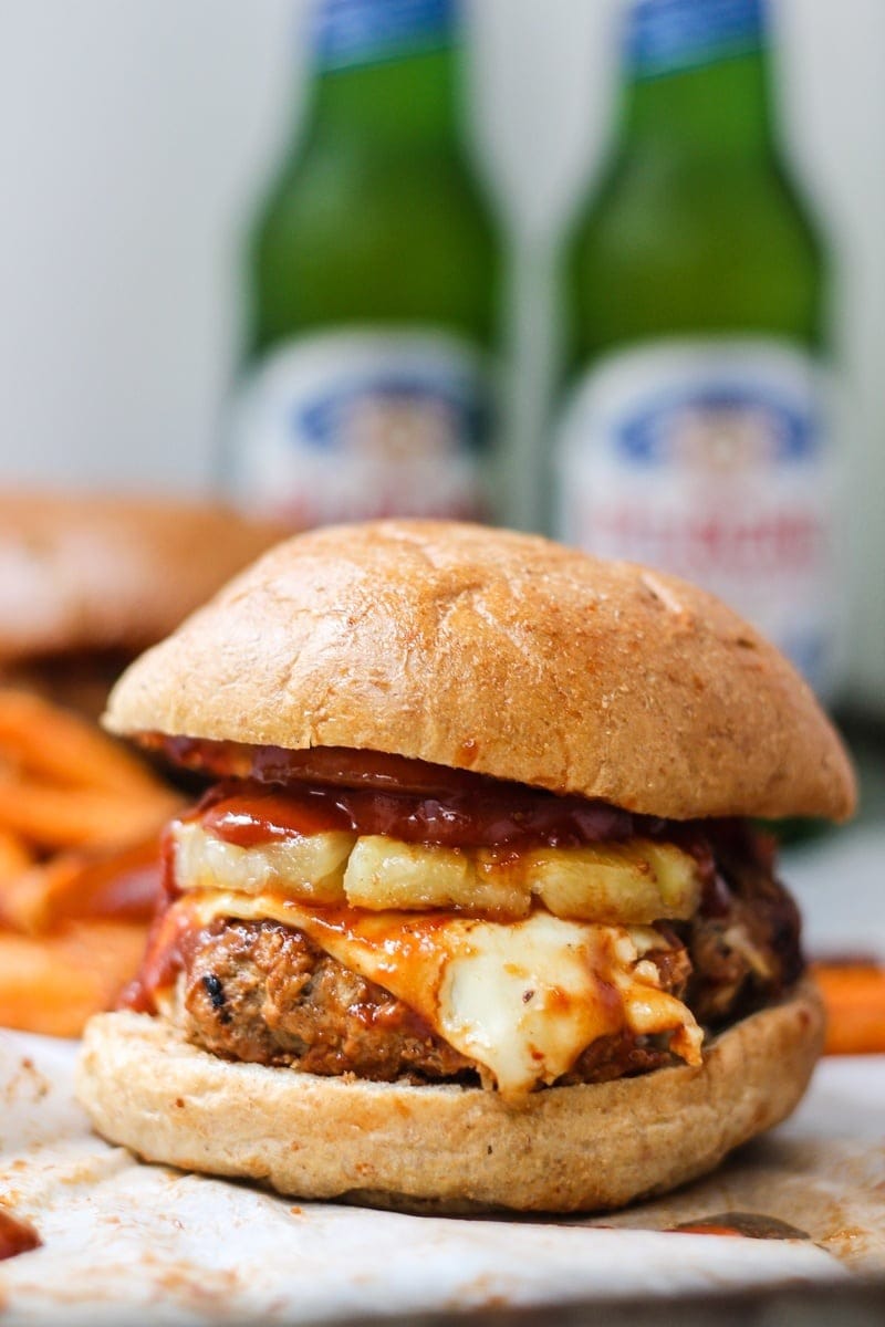 Burger with turkey, tomato, pineapple and cheese filling.