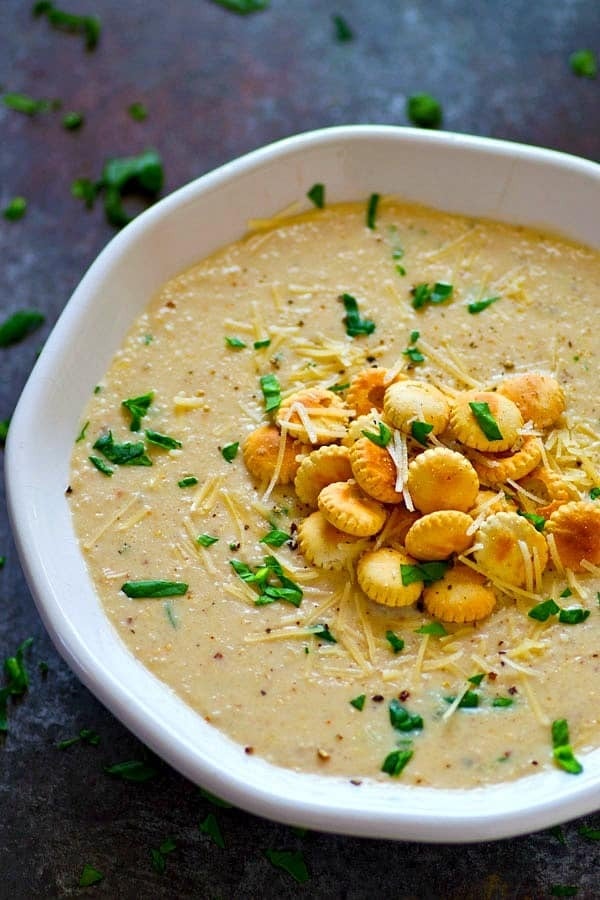 Top view of a bowl of Roasted Cream of Cauliflower Parmesan Soup
